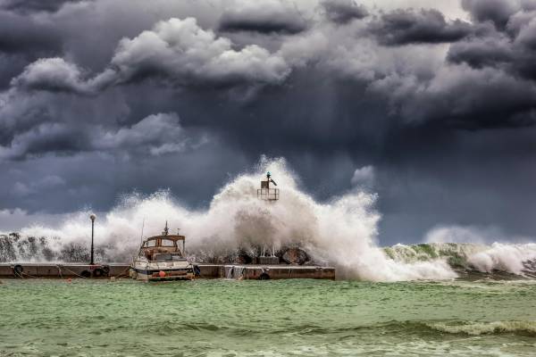photo of dark skies and destructive wave